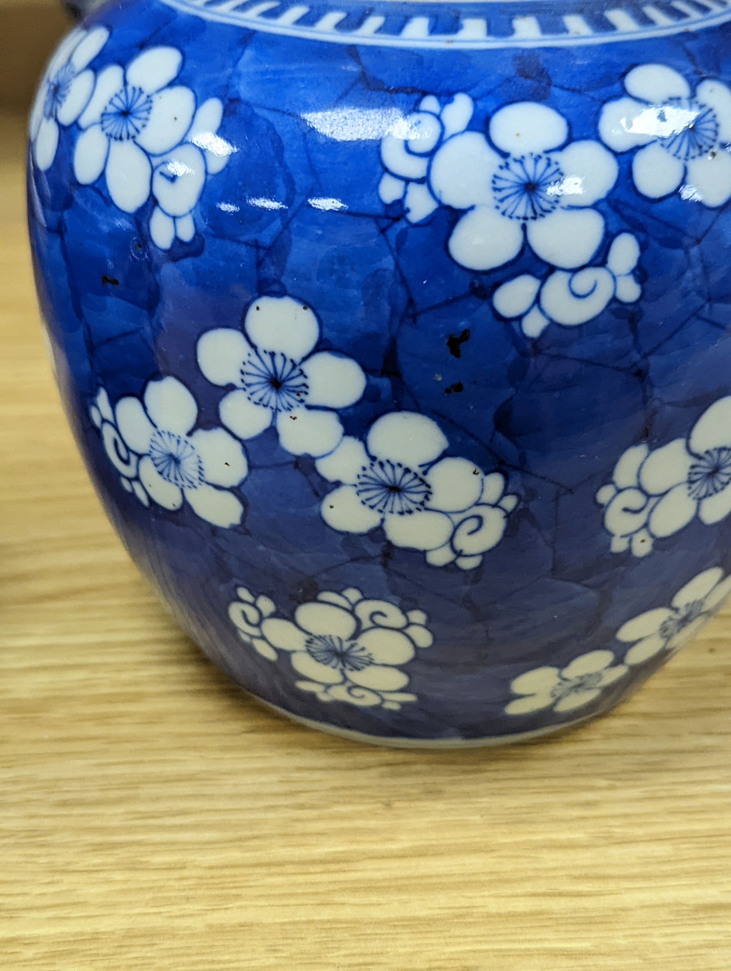 Three Chinese blue and white prunus decorated jars and covers, 19th/20th century, with four character marks 18cm